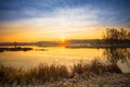 Bright beautiful Sunrise over Calm Lake, River and Royalty Free Stock Photo