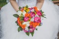 Bright beautiful wedding bouquet. Bride holds a wedding bouquet in her hands Royalty Free Stock Photo