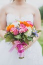 Bright beautiful wedding bouquet. Bride holds a wedding bouquet in her hands Royalty Free Stock Photo