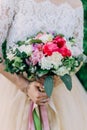 Bright beautiful wedding bouquet. Bride holds a wedding bouquet in her hands Royalty Free Stock Photo