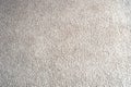 Bright beige wool fabric carpet or rug background texture close-up Royalty Free Stock Photo