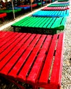 Bright benches on the black sea beach. Royalty Free Stock Photo