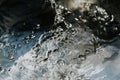 Bright and black frozen bubbles over the water with time stopped liquid Royalty Free Stock Photo