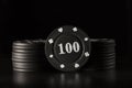 Bright black poker chips on a dark background Royalty Free Stock Photo