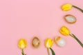 Bright blooming flowers and decorative easter eggs from gemstone onyx. Pattern from yellow tulips and stone eggs Royalty Free Stock Photo