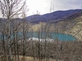 Bright blue artificial cooper mine lake. Royalty Free Stock Photo