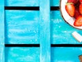 Bright blue background with coconut and strawberries Royalty Free Stock Photo