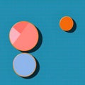 Three volumetric colored circles with shadows on a bright blue background.