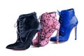 Bright blue, burgundy lace and black fur ankle boots. Footwear of three different colors and materials