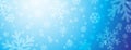 Bright blue christmas banner with blurred snowflakes. Merry Christmas and Happy New Year greeting banner. Horizontal new year