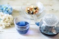 Bright blue color butterfly pea flower herb tea in a glass teapot and a cup Royalty Free Stock Photo