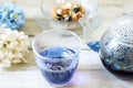 Bright blue color butterfly pea flower herb tea in a glass teapot and a cup Royalty Free Stock Photo