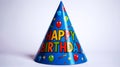 Bright blue conical party hat, colorful HAPPY BIRTHDAY text arc Royalty Free Stock Photo