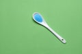 Bright blue copper sulfate in a spoon - Blue sea salt Royalty Free Stock Photo