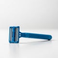 Bright Blue Disposable Razor with Three Blades on White Background shaving grooming Royalty Free Stock Photo