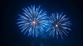 Bright blue fireworks explode against a dark night sky Royalty Free Stock Photo