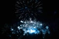 Bright blue fireworks in the night sky. New Year celebration Royalty Free Stock Photo