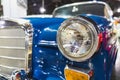 Bright Blue Front end of 1965 famous classic German Car defocused background