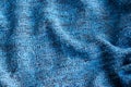 Bright blue knitted fabric texture. Crumpled blanket background Royalty Free Stock Photo