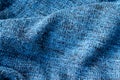 Bright blue knitted fabric texture. Crumpled blanket background Royalty Free Stock Photo