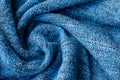 Bright blue knitted fabric texture. Crumpled twisted blanket background Royalty Free Stock Photo