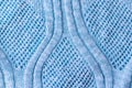 Bright blue knitted fabric texture. Rough sweater pattern background Royalty Free Stock Photo