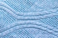 Bright blue knitted fabric texture. Rough sweater pattern background Royalty Free Stock Photo