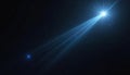 Bright blue light beam shoots from star in dark cosmos. Tiny stars and dust float in deep black empty space. Cosmic background, Royalty Free Stock Photo