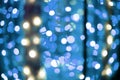 Bright blue lights bokeh effect from festive garland light unfocused blurred abstract Royalty Free Stock Photo