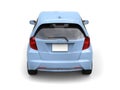 Bright blue modern compact car - back view