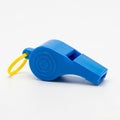 Bright Blue Plastic Whistle with a Yellow Lanyard on a White Background string Royalty Free Stock Photo