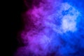 Bright blue and purple smoke isolated on black background