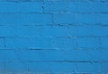 Bright blue rough cinder block wall. Background and texture Royalty Free Stock Photo