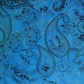 Paisley patterned background in shades blue and black.