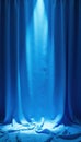 Bright blue silk curtain, sharp spotlight beam, illumination, celebration Royalty Free Stock Photo