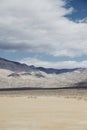 Clouds casting shadows onto mountains and desert landscape Royalty Free Stock Photo