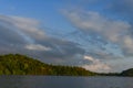 Bright blue sky with clouds over lake Royalty Free Stock Photo