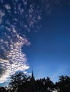 Bright blue sky with clouds over the temple