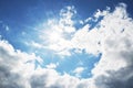 Bright blue sky with clouds and sun rays Royalty Free Stock Photo