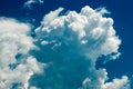 Bright blue sky with curly clouds background Royalty Free Stock Photo