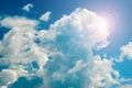 Bright blue sky with curly clouds background Royalty Free Stock Photo