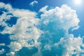 Bright blue sky with curly clouds background Royalty Free Stock Photo