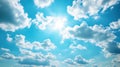 Bright Sun Shines in a Beautiful Blue Sky With Fluffy White Clouds Royalty Free Stock Photo