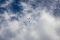 Bright blue sky with jet fighter formation flying