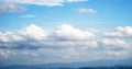 Bright blue sky with many drifting clouds Royalty Free Stock Photo