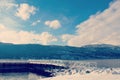 Bright blue sky over winter lake landscape