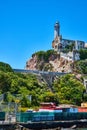 Bright blue sky overhead Alcatraz Island lighthouse with pier view of island Royalty Free Stock Photo