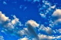 Bright Blue Sky with puffy scattered clouds