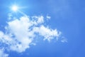 Bright blue sky with sun and clouds background Royalty Free Stock Photo
