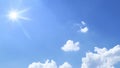 bright blue sky with sun and clouds background Royalty Free Stock Photo